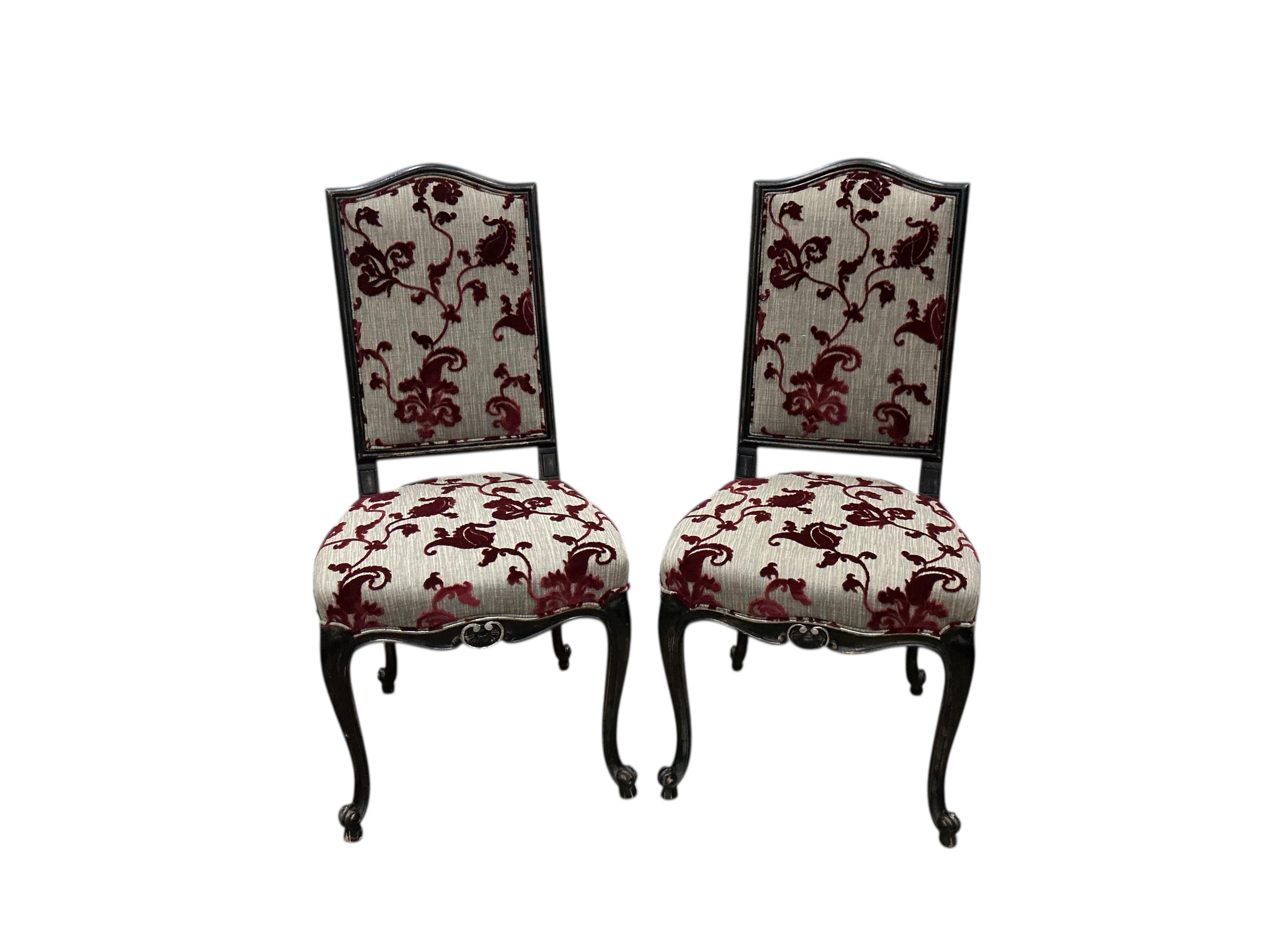 A set of eight Roche Bobois Louis XV style ebonised dining chairs, two with arms